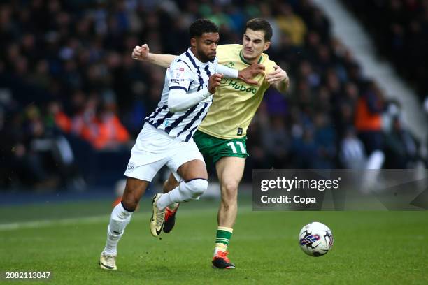 Darnell Furlong of West Bromwich Albion battles for possession with Anis Mehmeti of Bristol City during the Sky Bet Championship match between West...