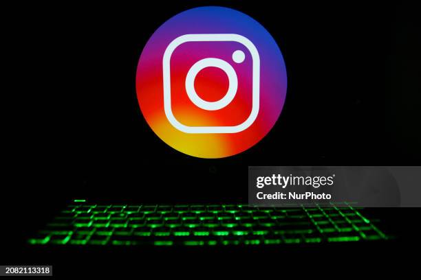 The Instagram logo is being displayed on a laptop screen with a glowing keyboard in Krakow, Poland, on March 3, 2024.