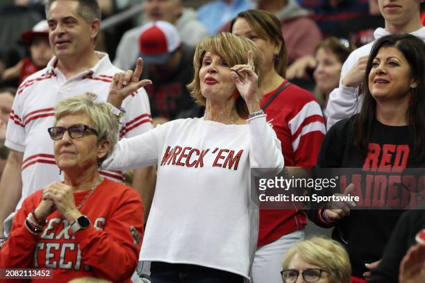 Texas Tech Red Raiders fan has "Wreck Em" on her shirt in the second half of a Big 12 tournament quarterfinal game between the Brigham Young Cougars...