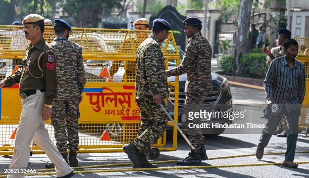 Police personnel deployed outside the Rouse Avenue Court before the arrival of Delhi Chief Minister Arvind Kejriwal to appear in the Enforcement...