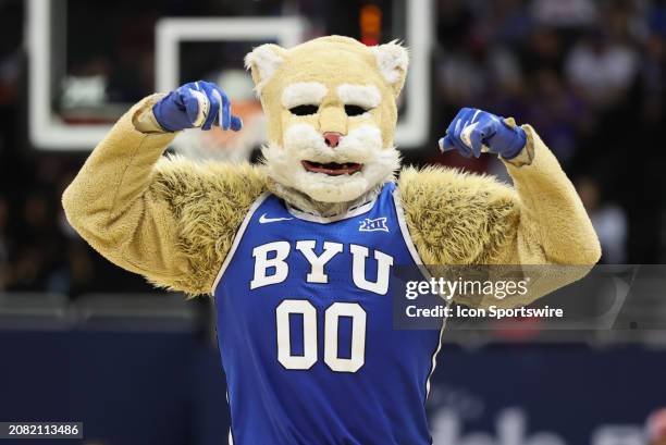 The Brigham Young Cougars mascot flexes in the first half of a Big 12 tournament quarterfinal game between the Brigham Young Cougars and Texas Tech...