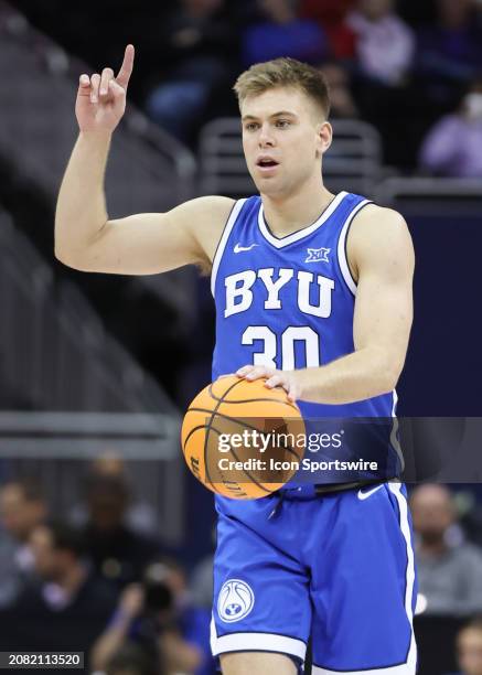 Brigham Young Cougars guard Dallin Hall with the ball in the first half of a Big 12 tournament quarterfinal game between the Brigham Young Cougars...