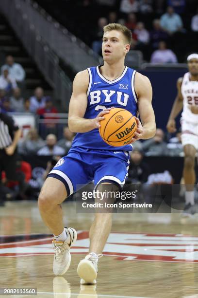 Brigham Young Cougars guard Dallin Hall looks to pull up for a jump shot in the first half of a Big 12 tournament quarterfinal game between the...