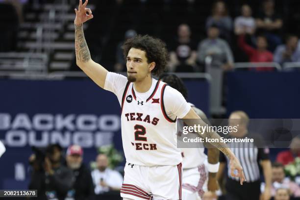 Texas Tech Red Raiders guard Pop Isaacs celebrates making a three in the first half of a Big 12 tournament quarterfinal game between the Brigham...