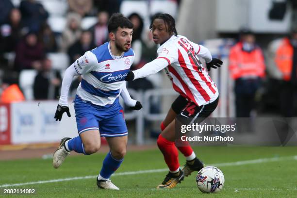 Ilias Chair of Queens Park Rangers is taking on Romaine Mundle of Sunderland during the Sky Bet Championship match at the Stadium of Light in...