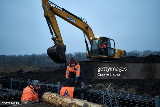 Representatives of the Regional Administration and the construction contractor inspect the fortifications being built in the region on March 16, 2024...