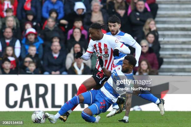 Kenneth Paal of QPR is tackling Sunderland's Romaine Mundle during the Sky Bet Championship match between Sunderland and Queens Park Rangers at the...