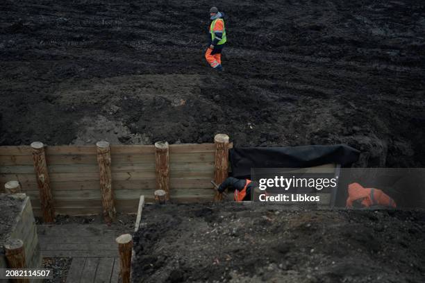 Representatives of the Regional Administration and the construction contractor inspect the fortifications being built in the region on March 16, 2024...