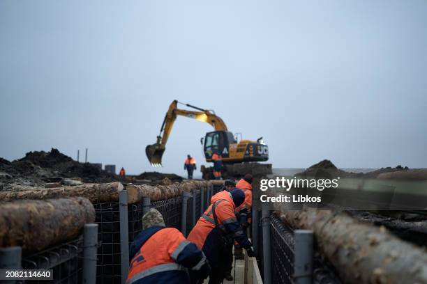 Representatives of the Regional Administration and the construction contractor inspect the fortifications being built in the region on March 16, 2024...