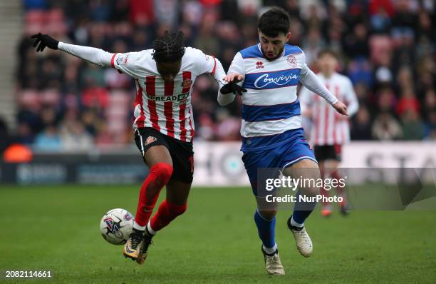 Romaine Mundle of Sunderland is being challenged by Ilias Chair of QPR during the Sky Bet Championship match between Sunderland and Queens Park...