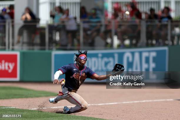 Isaiah Drake of the Atlanta Braves attempts to make a diving catch during the 2024 Spring Breakout Game between the Atlanta Braves and the Boston Red...