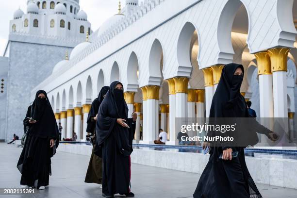 Muslims are waiting for Iftar, the breaking of the fast, on the first day of the Muslim holy fasting month of Ramadan at the Sheikh Zayed Grand...