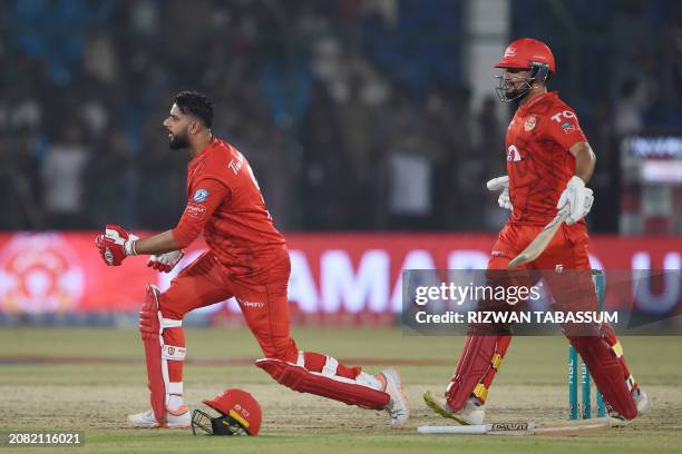 Islamabad United's Imad Wasim Haider Ali celebrate their victory at the end of the Pakistan Super League Twenty20 cricket eliminator match between...