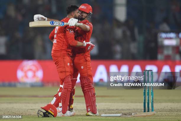 Islamabad United's Imad Wasim Haider Ali celebrate their victory at the end of the Pakistan Super League Twenty20 cricket eliminator match between...