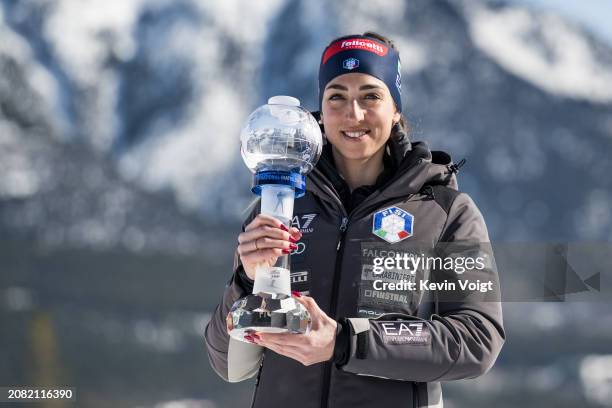 Lisa Vittozzi of Italy with the trophy for the pursuit world cup score after the Women 10 km Pursuit at the BMW IBU World Cup Biathlon on March 16,...