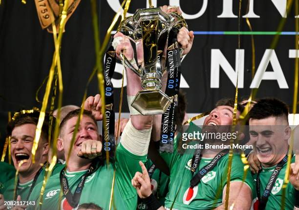 Dublin , Ireland - 16 March 2024; Ireland captain Peter O'Mahony, right, and Tadhg Furlong lift the Six Nations trophy after the Guinness Six Nations...