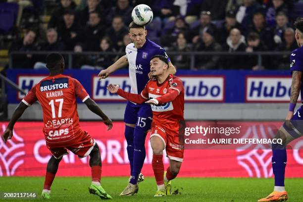 Anderlecht's Ludwig Augustinsson and Kortrijk's Nayel Mehssatou fight for the ball during a soccer match between RSC Anderlecht and KV Kortrijk,...