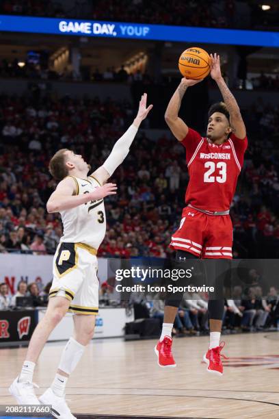 Wisconsin Badgers guard Chucky Hepburn shoots the ball while being defended by Purdue Boilermakers guard Braden Smith during the second half of a Big...