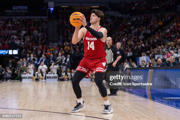 Wisconsin Badgers forward Carter Gilmore looks to shoot the ball during the second half of a Big Ten Men's Basketball Tournament semi finals game...