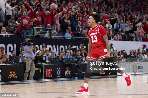 Wisconsin Badgers guard Chucky Hepburn celebrates a win after the Big Ten Men's Basketball Tournament semi finals game between the Purdue...