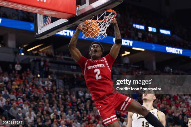 Wisconsin Badgers guard AJ Storr dunks the ball during overtime of a Big Ten Men's Basketball Tournament semi finals game between the Purdue...