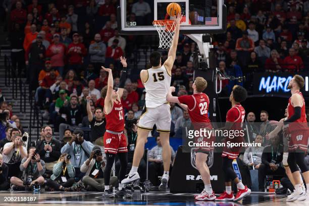 Purdue Boilermakers center Zach Edey goes up for a shot over Wisconsin Badgers forward Steven Crowl during the second half of a Big Ten Men's...