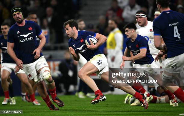 France's wing Damian Penaud runs with the ball during the Six Nations international rugby union match between France and England at the Groupama...