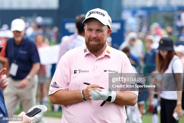 Golfer Shane Lowry signs an autograph after coming off the 18th green during the third round of The Players Championship on March 16 at TPC Sawgrass...