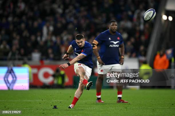 France's fly-half Thomas Ramos kicks and scores the last penalty to win the Six Nations international rugby union match between France and England at...