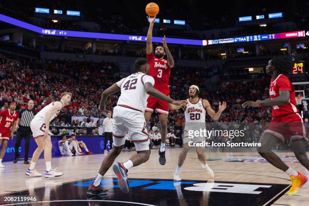 Nebraska Cornhuskers guard Brice Williams goes up for a shot over Illinois Fighting Illini forward Dain Dainja during the first half of the Big Ten...