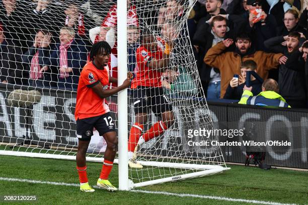 Teden Mengi of Luton Town runs into the back of the net after clearing the ball off the line during the Premier League match between Luton Town and...