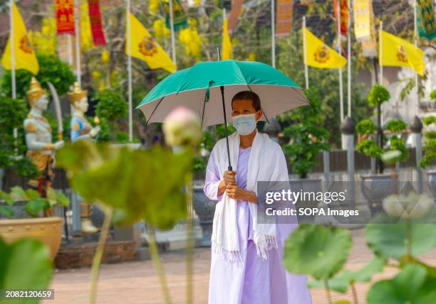 Thai Buddhist nun wears a mask amid smog from heavy concentrations of fine particulates matter PM2.5, in Chiang Mai. Air pollution haze in Chiang Mai...