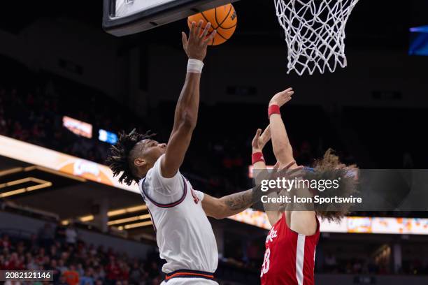Illinois Fighting Illini guard Terrence Shannon Jr. Goes up for a shot over Nebraska Cornhuskers forward Josiah Allick during the second half of the...
