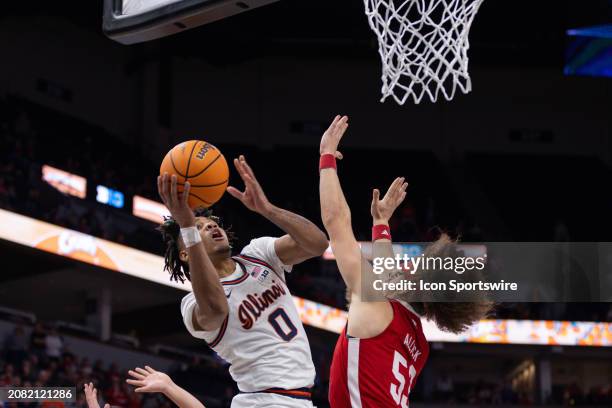 Illinois Fighting Illini guard Terrence Shannon Jr. Goes up for a shot over Nebraska Cornhuskers forward Josiah Allick during the second half of the...