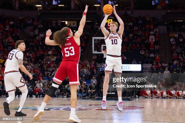 Illinois Fighting Illini guard Luke Goode shoots the ball while being defended by Nebraska Cornhuskers forward Josiah Allick during the second half...