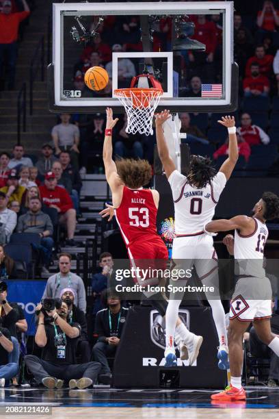 Nebraska Cornhuskers forward Josiah Allick goes up for a shot while being defended by Illinois Fighting Illini guard Terrence Shannon Jr. During the...