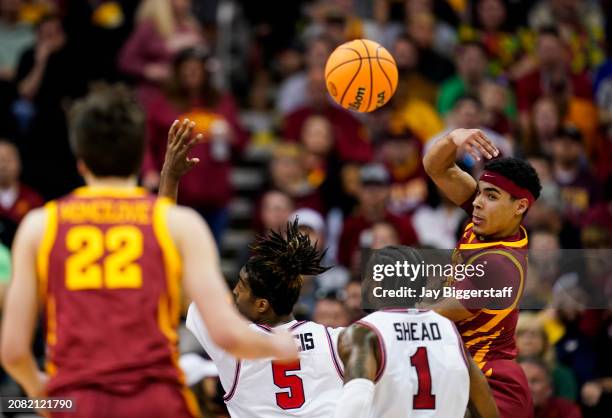 Tamin Lipsey of the Iowa State Cyclones passes to Milan Momcilovic during the first half of the Big 12 Men's Basketball Tournament championship game...