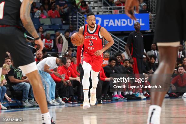 McCollum of the New Orleans Pelicans dribbles the ball during the game against the Portland Trail Blazers on March 16, 2024 at the Smoothie King...