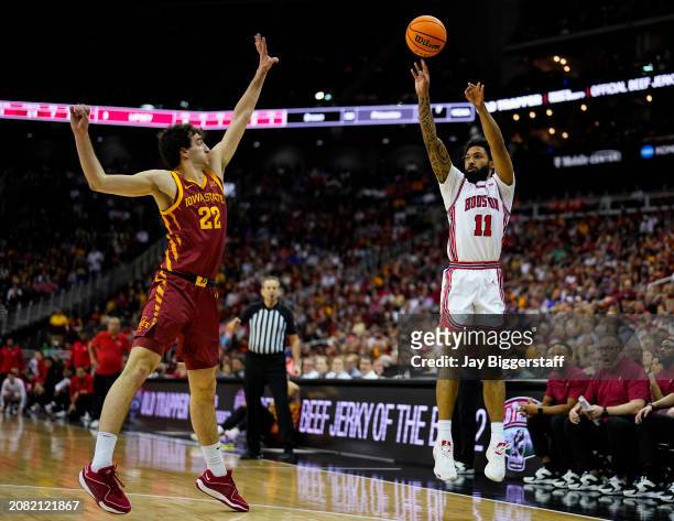 Damian Dunn of the Houston Cougars shoots against Hason Ward of the Iowa State Cyclones during the first half of the Big 12 Men's Basketball...