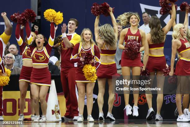 Iowa State Cyclones cheerleaders go crazy celebrating a three in the first half of the Big 12 tournament final between the Iowa State Cyclones and...