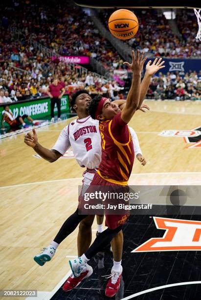 Tamin Lipsey of the Iowa State Cyclones shoots against Cedric Lath of the Houston Cougars during the first half of the Big 12 Men's Basketball...