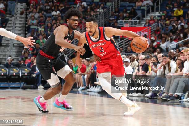 McCollum of the New Orleans Pelicans dribbles the ball during the game against the Portland Trail Blazers on March 16, 2024 at the Smoothie King...