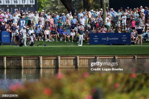 Pan of Taiwan plays a shot from the 17th tee during the third round of THE PLAYERS Championship at Stadium Course at TPC Sawgrass on March 16, 2024...