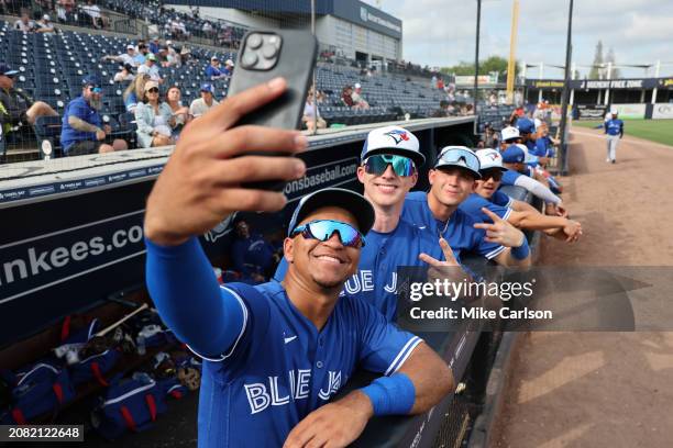 Manuel Beltre of the Toronto Blue Jays takes a selfie with his teammates prior to the 2024 Spring Breakout Game between the Toronto Blue Jays and the...