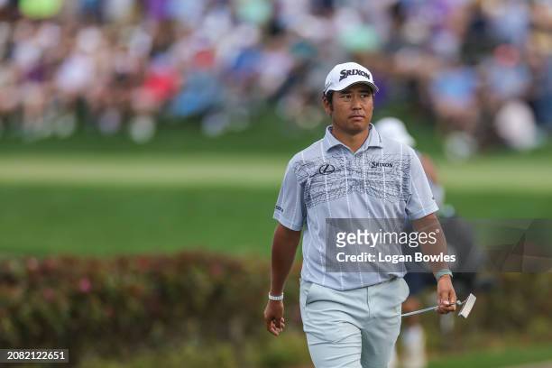 Hideki Matsuyama of Japan walks the 17th hole during the third round of THE PLAYERS Championship at Stadium Course at TPC Sawgrass on March 16, 2024...