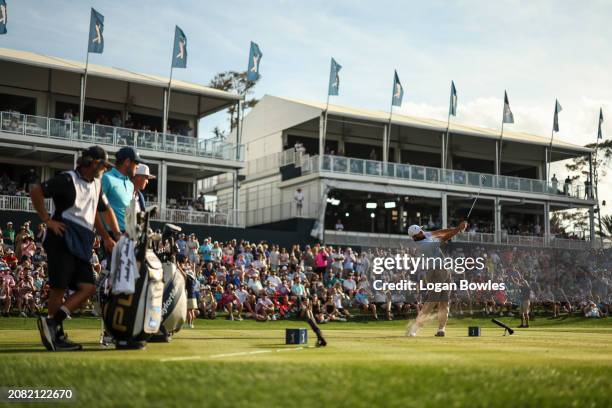 Scottie Scheffler plays a shot on the 17th tee during the third round of THE PLAYERS Championship at Stadium Course at TPC Sawgrass on March 16, 2024...