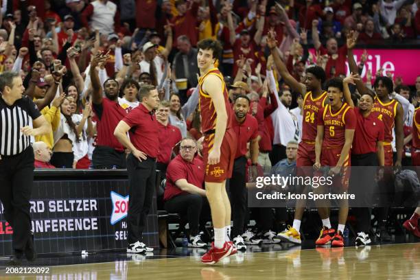 Iowa State Cyclones fans and the bench goes wild after forward Milan Momcilovic hit a three in the second half of the Big 12 tournament final between...