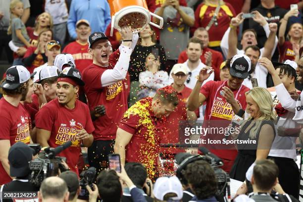 Confetti is dropped on Iowa State Cyclones head coach T.J. Otzelberger on the podium after winning the Big 12 tournament final against the Houston...