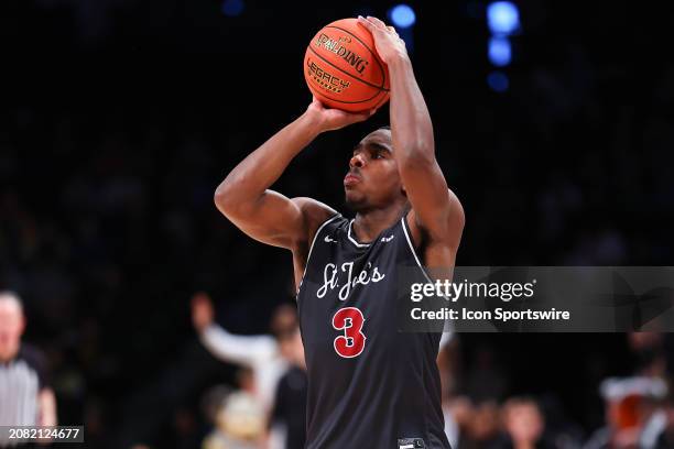 Cameron Brown of the Saint Joseph's Hawks shoots the ball during the first half of the Atlantic 10 Conference semi final game against the Virginia...