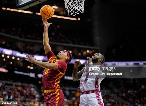 Tamin Lipsey of the Iowa State Cyclones shoots against Jamal Shead of the Houston Cougars during the second half of the Big 12 Men's Basketball...